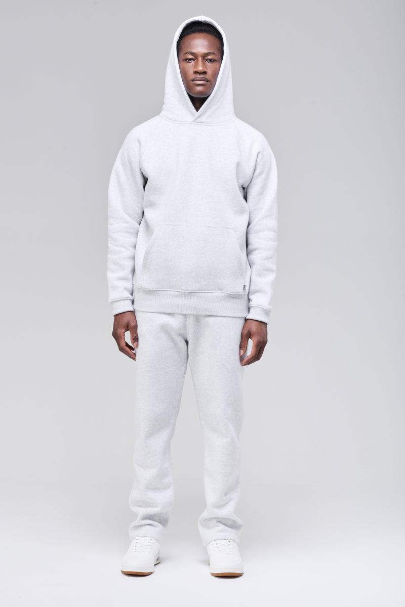 Sunday Superior Belmont Hoodie in heather grey, male model front view with hood up