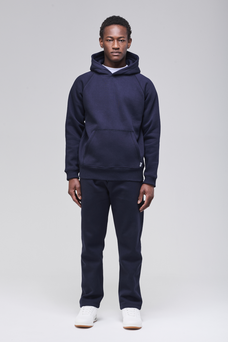 Sunday Superior Belmont Hoodie in rich navy, male model front view, classic fit.