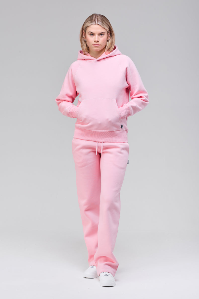Model wearing pink classic hoodie, front full figure