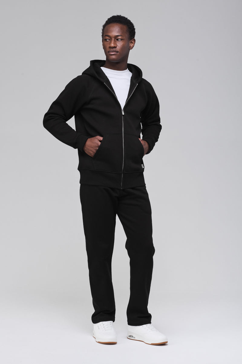 Angled front, hands in front pockets