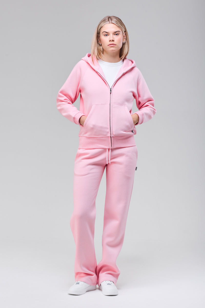 Model wearing pink zip hoodie, full figure front